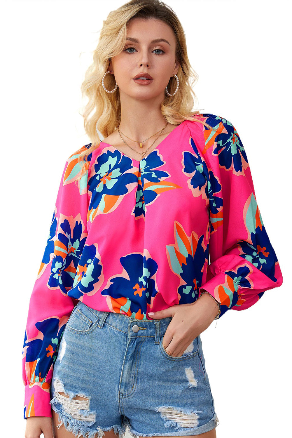 A stylish Rose Flower Puff Sleeve Blouse featuring a vibrant floral print, flattering V-neckline, and elegant long puff sleeves.