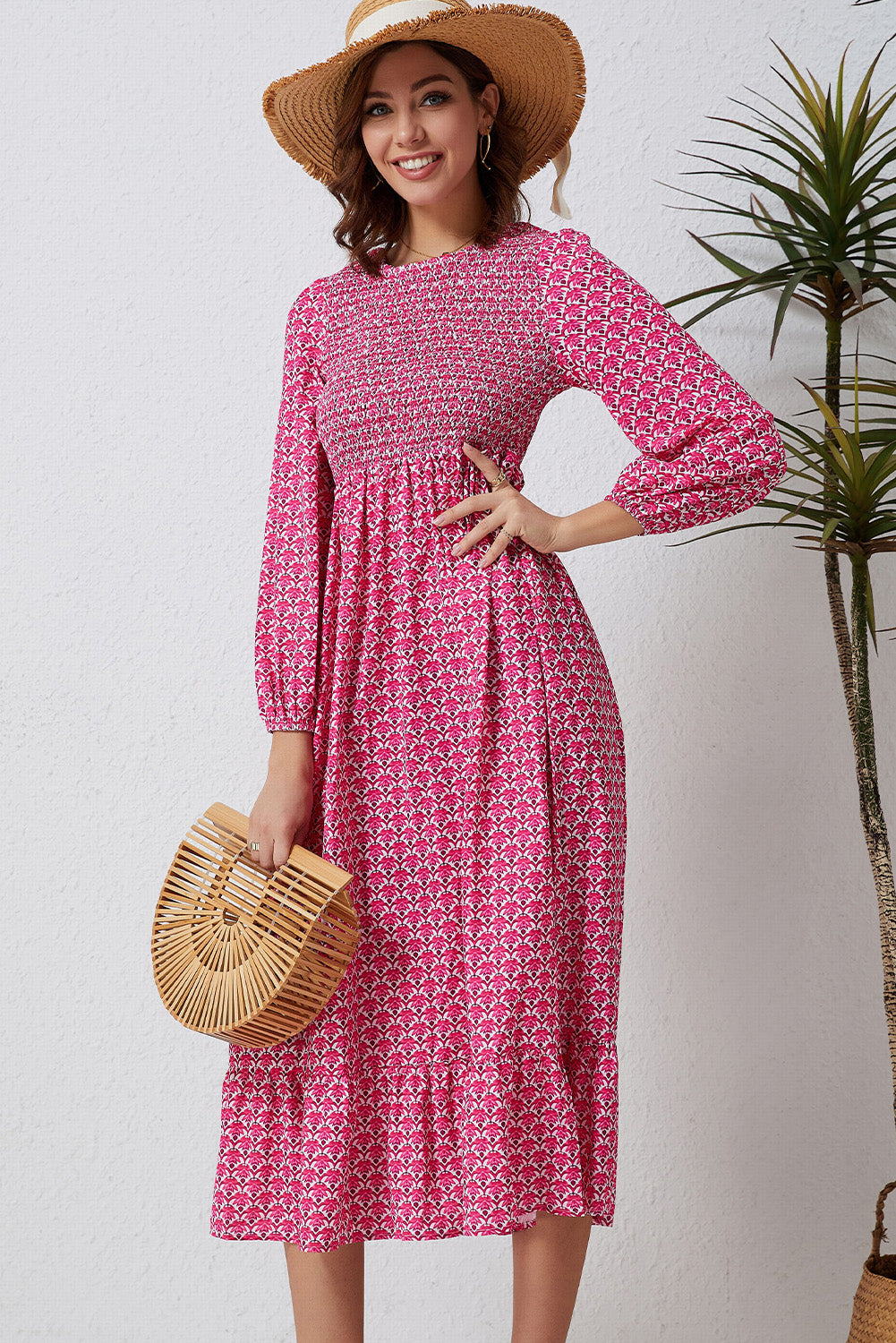 A beautiful long dress featuring a rose print, ruffled hem, and puff sleeves, perfect for feminine fashion styles.