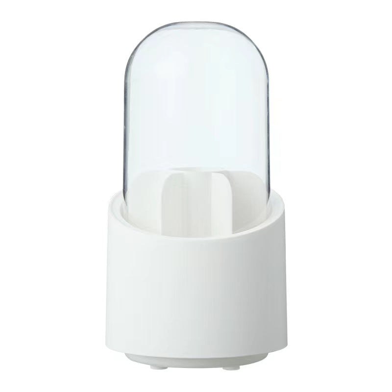 A stylish rotating makeup brush divider with a lidded cover, showcasing various makeup brushes organized neatly inside.