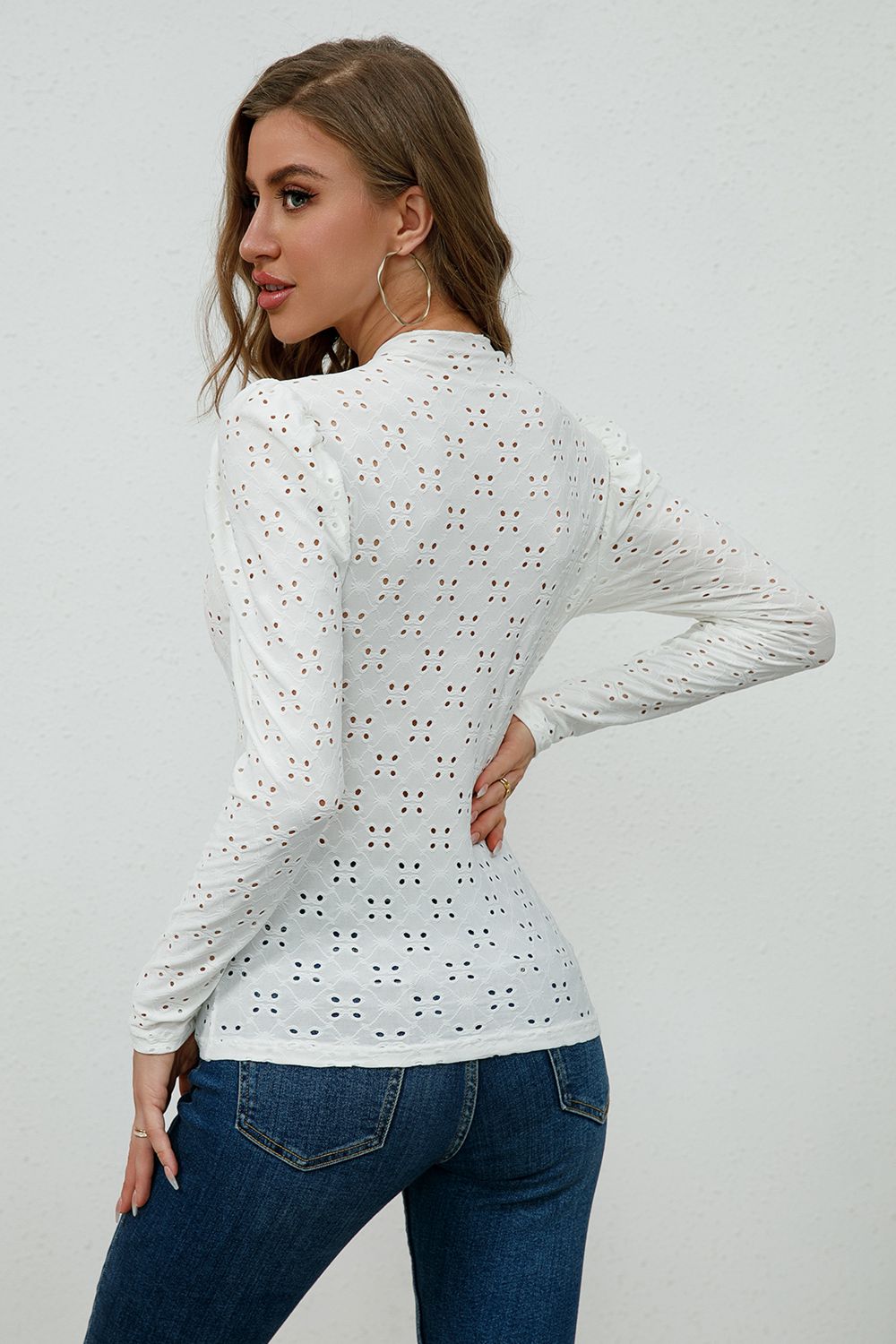 Round Neck Eyelet Long Sleeve Blouse in solid color with eyelet detailing, showcasing its chic design and comfortable fit.