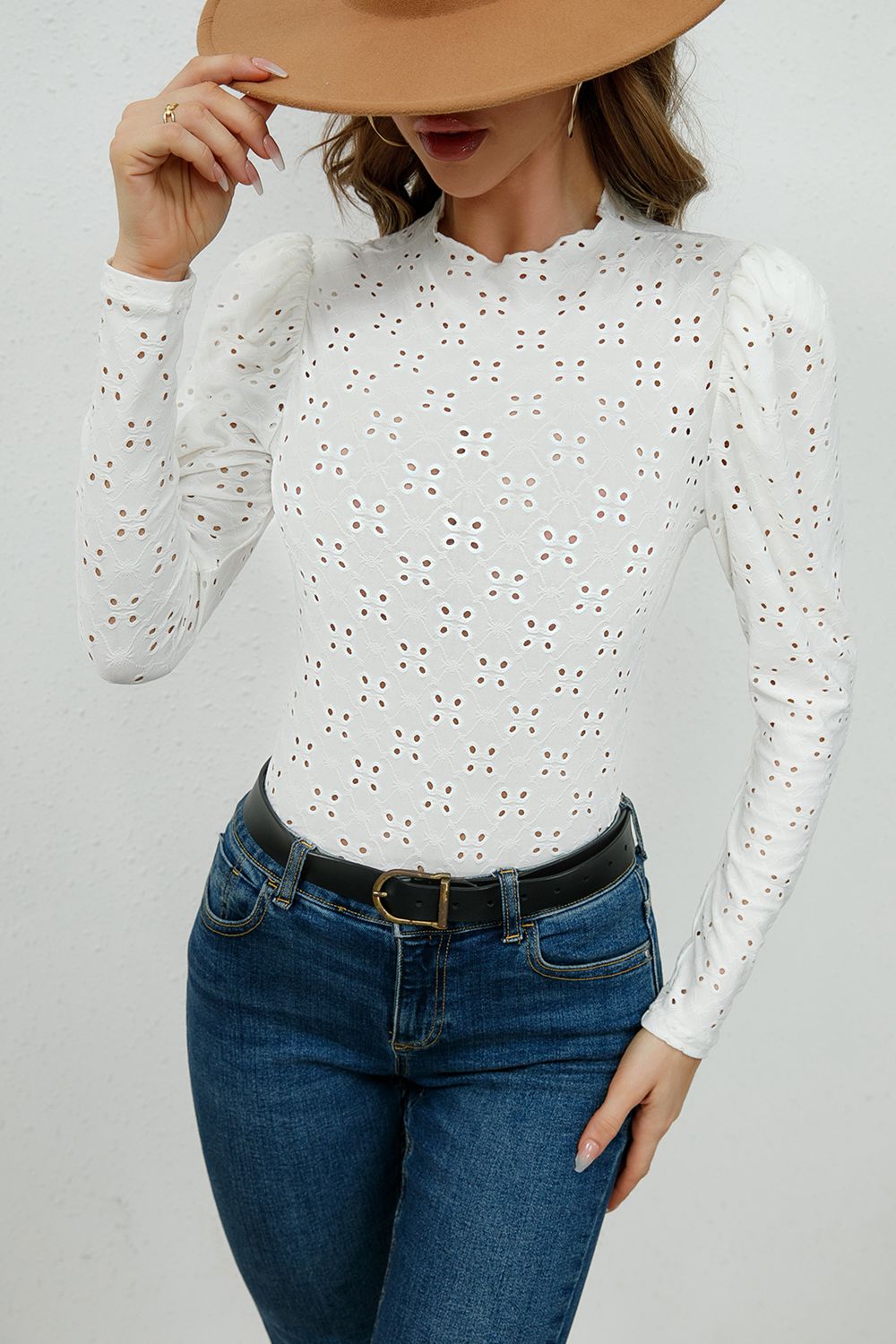 Round Neck Eyelet Long Sleeve Blouse in solid color with eyelet detailing, showcasing its chic design and comfortable fit.