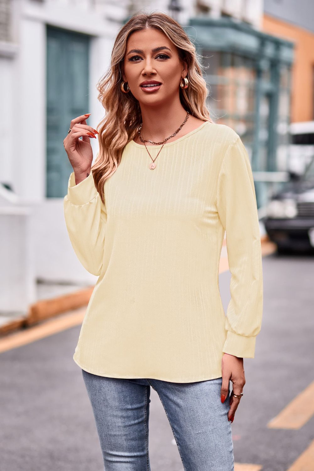 A stylish round neck long sleeve tee in solid color, made from 100% polyester, showcasing its casual design and comfortable fit.