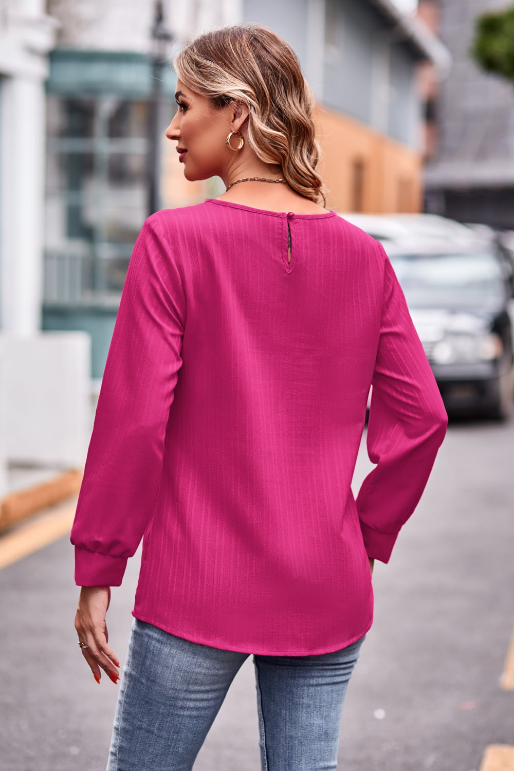 A stylish round neck long sleeve tee in solid color, made from 100% polyester, showcasing its casual design and comfortable fit.