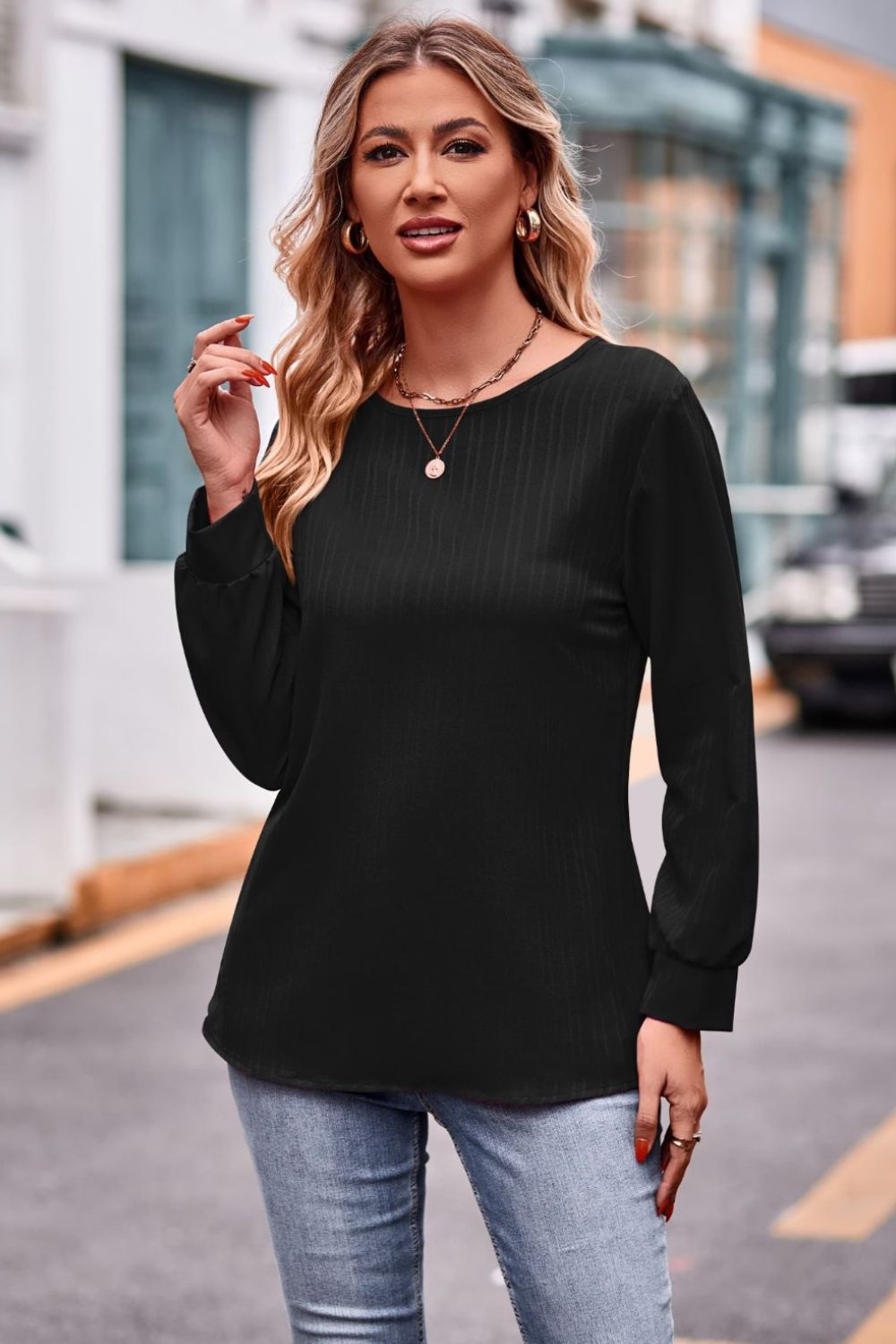 A stylish round neck long sleeve tee in solid color, made from 100% polyester, showcasing its casual design and comfortable fit.