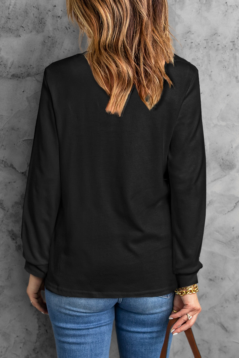 A stylish round neck long sleeve top in solid color, showcasing its casual design and comfortable fit.