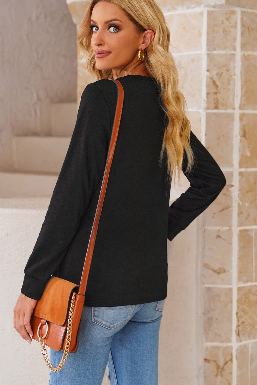 A stylish round neck long sleeve top in solid color, showcasing its casual design and comfortable fit.