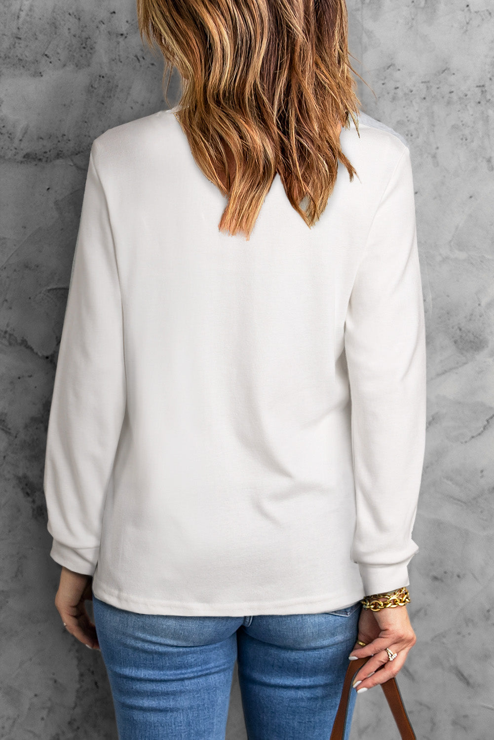 A stylish round neck long sleeve top in solid color, showcasing its casual design and comfortable fit.