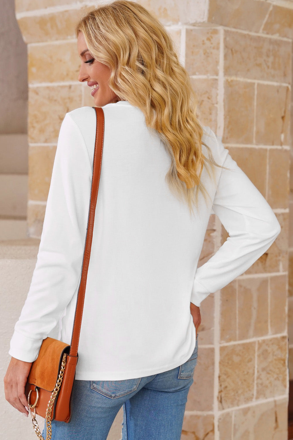 A stylish round neck long sleeve top in solid color, showcasing its casual design and comfortable fit.