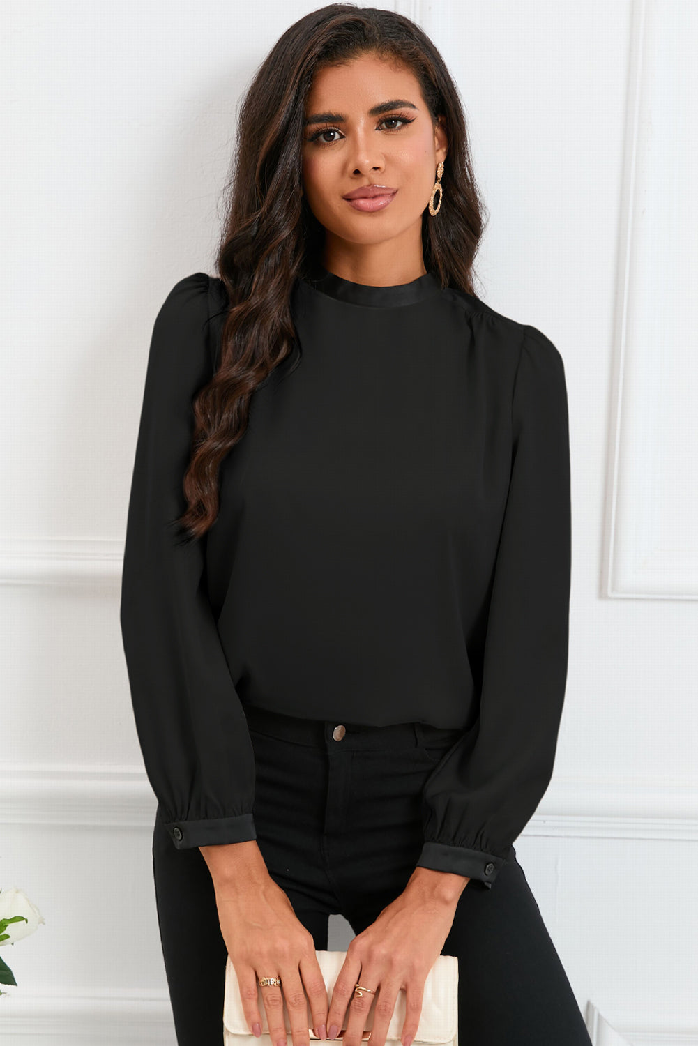 Round neck blouse with puff sleeves and back tie detail, showcasing a solid color design.