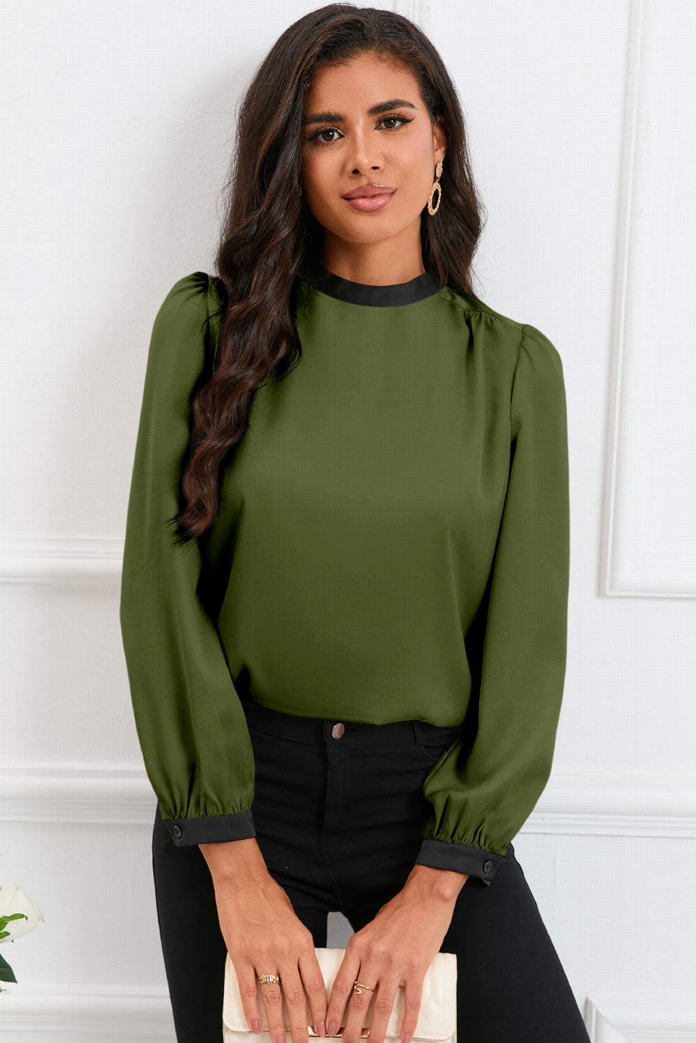 Round neck blouse with puff sleeves and back tie detail, showcasing a solid color design.