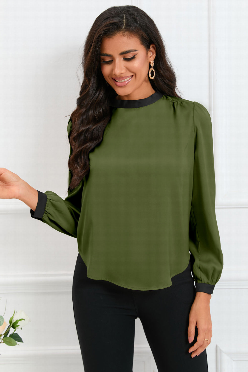 Round neck blouse with puff sleeves and back tie detail, showcasing a solid color design.