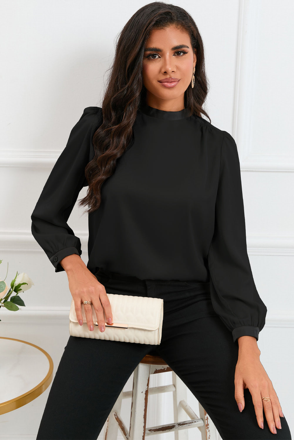 Round neck blouse with puff sleeves and back tie detail, showcasing a solid color design.