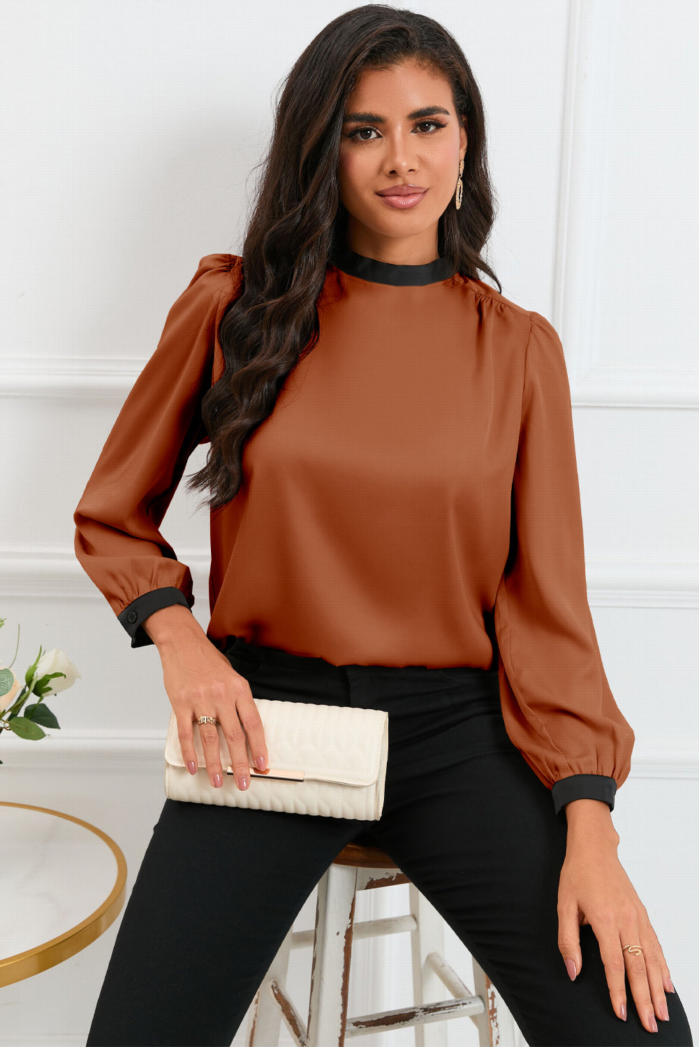 Round neck blouse with puff sleeves and back tie detail, showcasing a solid color design.