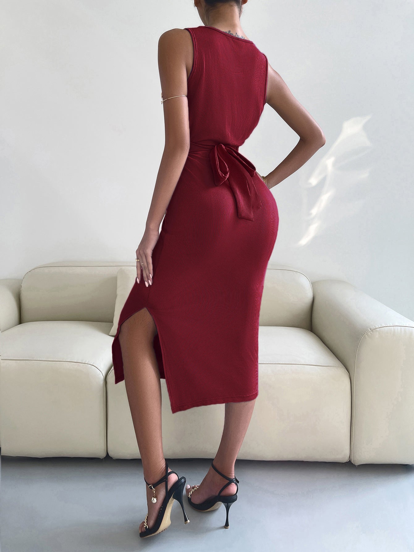 A stylish round neck tie back slit sleeveless dress in solid color, showcasing a chic design and flattering silhouette.