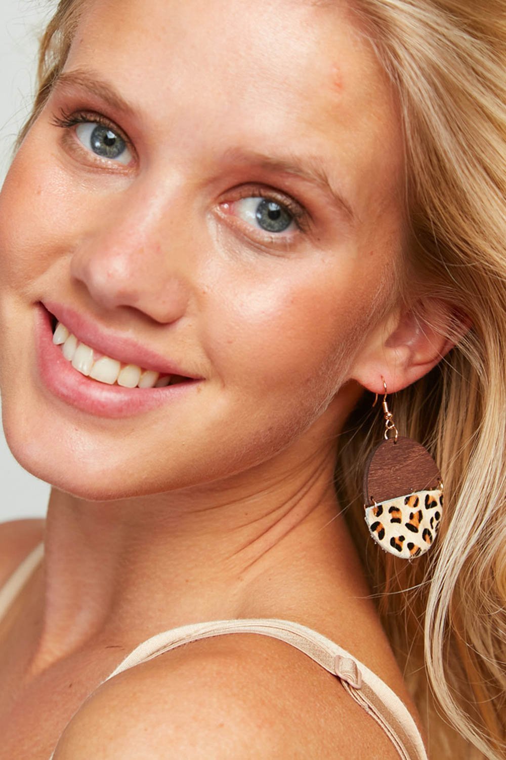 Round wood leopard dangling earrings featuring a trendy design with a leopard print pattern, made from acrylic and resin materials.