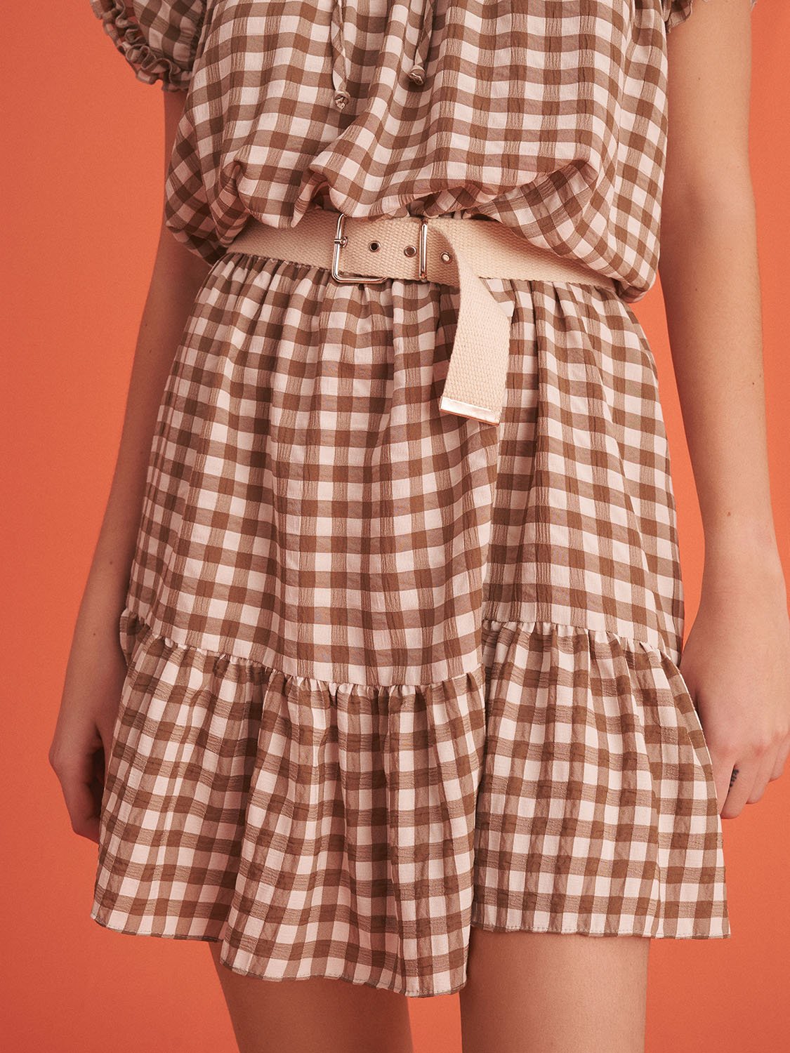 A stylish Ruched Plaid Dress featuring a ruffled band collar, short sleeves, and a flounced hem, perfect for summer outings.