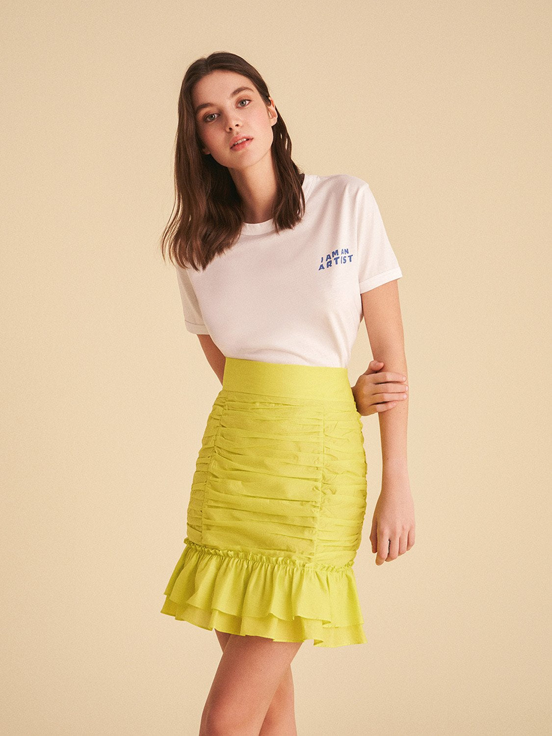 A stylish ruched skirt with a flounced hem in vibrant blue and pink colors, showcasing a summer-inspired design.