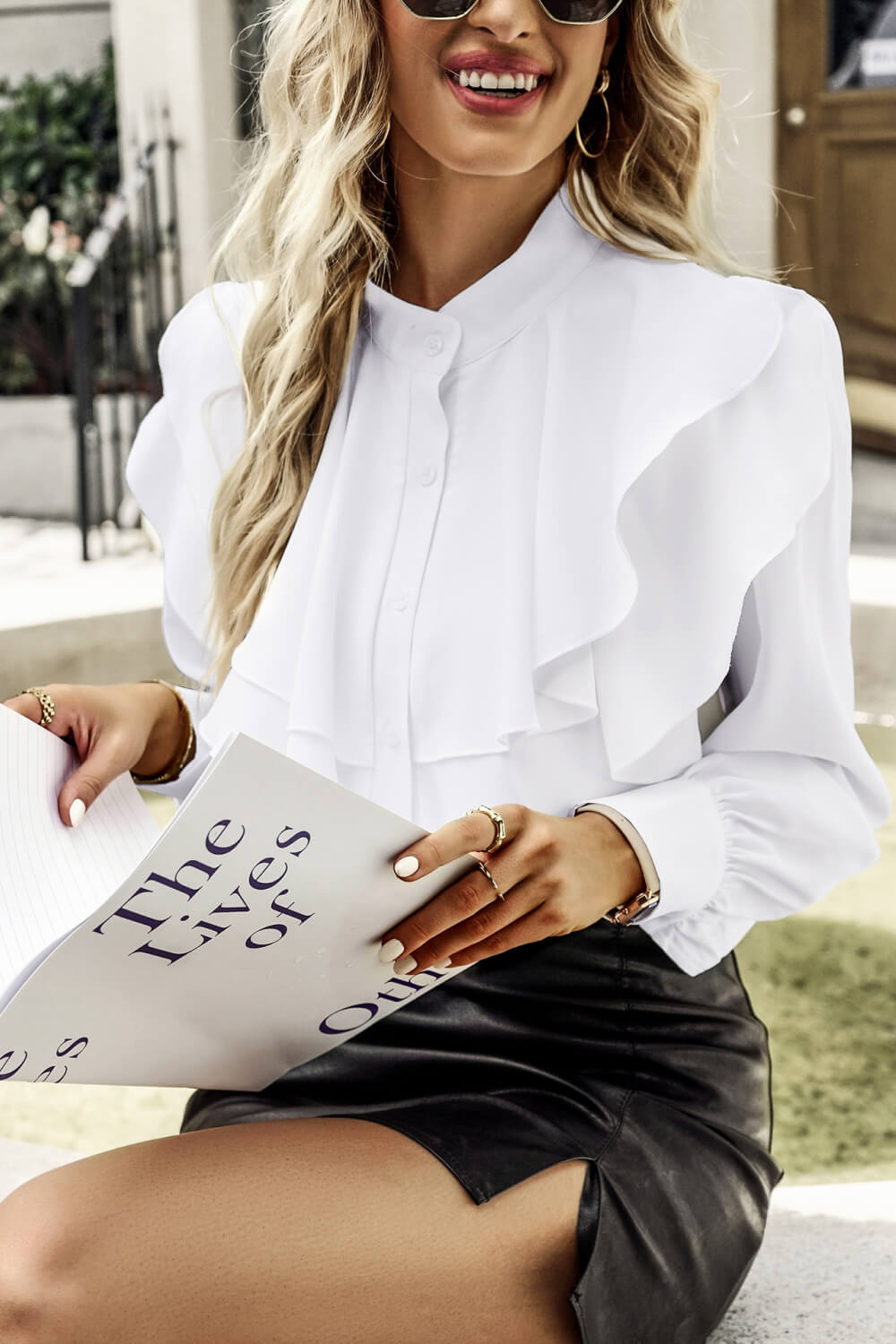 A stylish Ruffled Button-Up Puff Sleeve Blouse featuring layered ruffles, long puff sleeves, and a band collar, perfect for chic outfits.