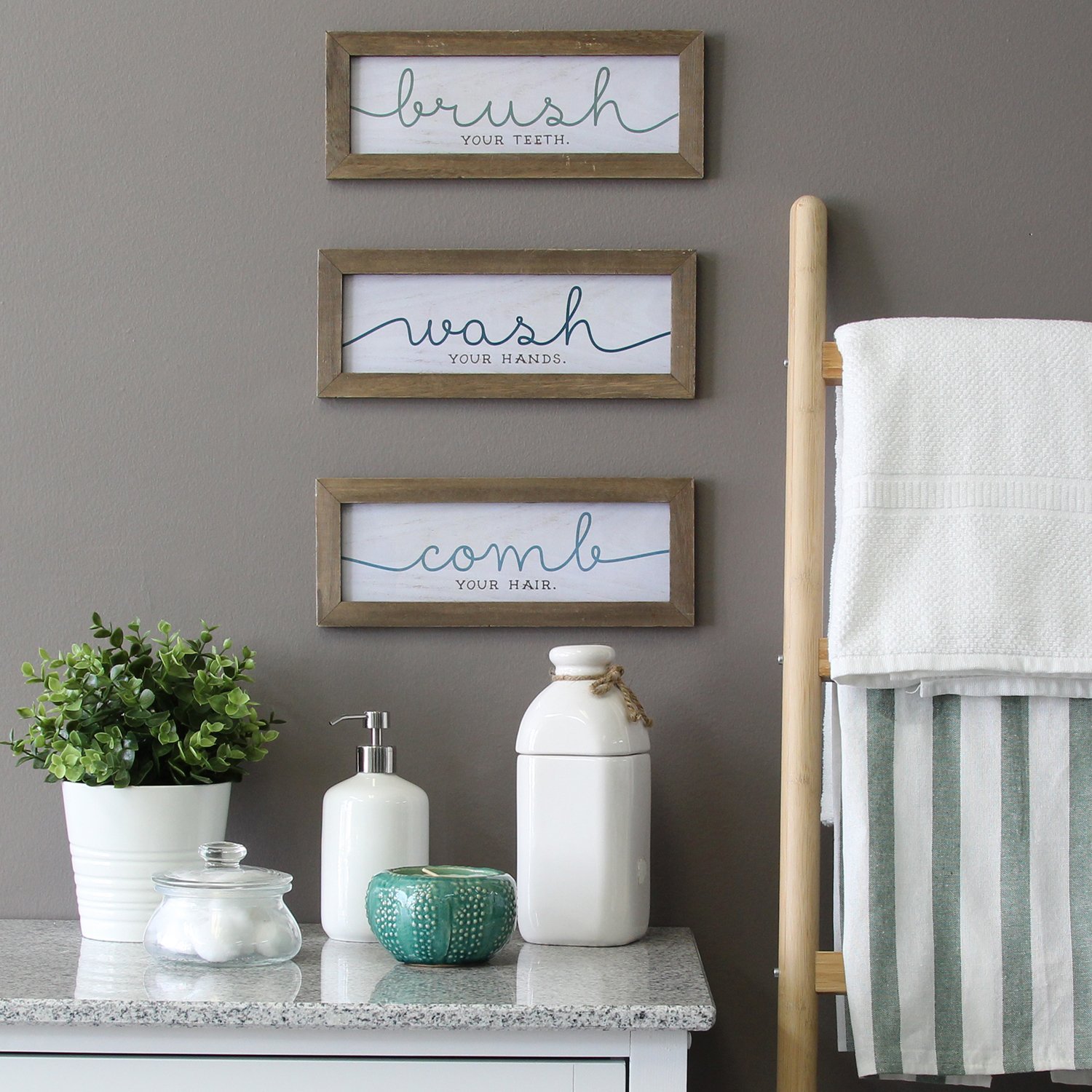 Rustic set of three bathroom wall art frames with grooming instructions in teal and blue typography on white wash backgrounds.