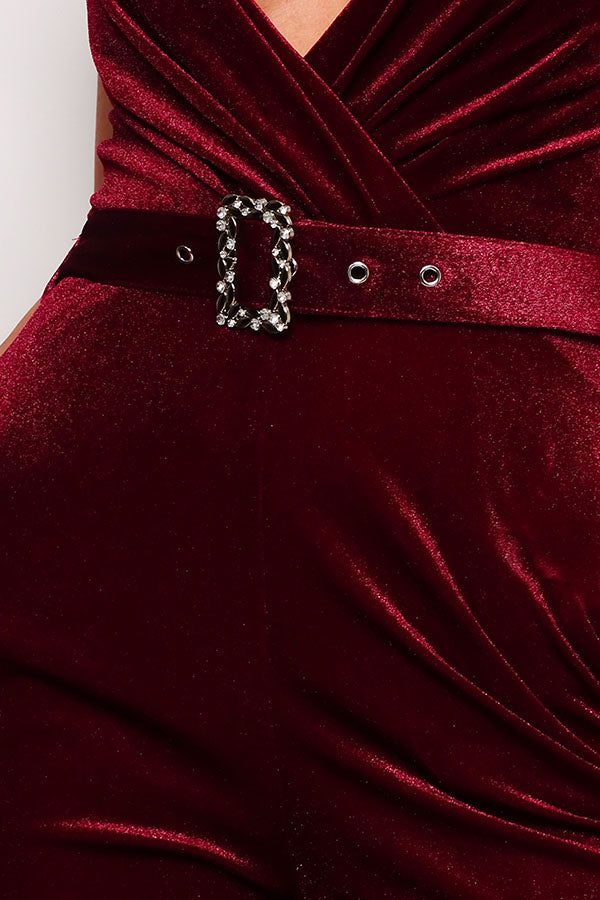 Samba Rhinestone Belt Velvet Jumpsuit in burgundy with spaghetti straps and rhinestone buckle belt, showcasing a deep V neckline and gathered bust detail.