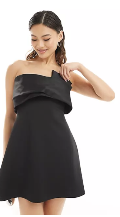 A stylish black satin bow bandeau A-line mini dress displayed on a mannequin, showcasing its elegant design and flattering silhouette.