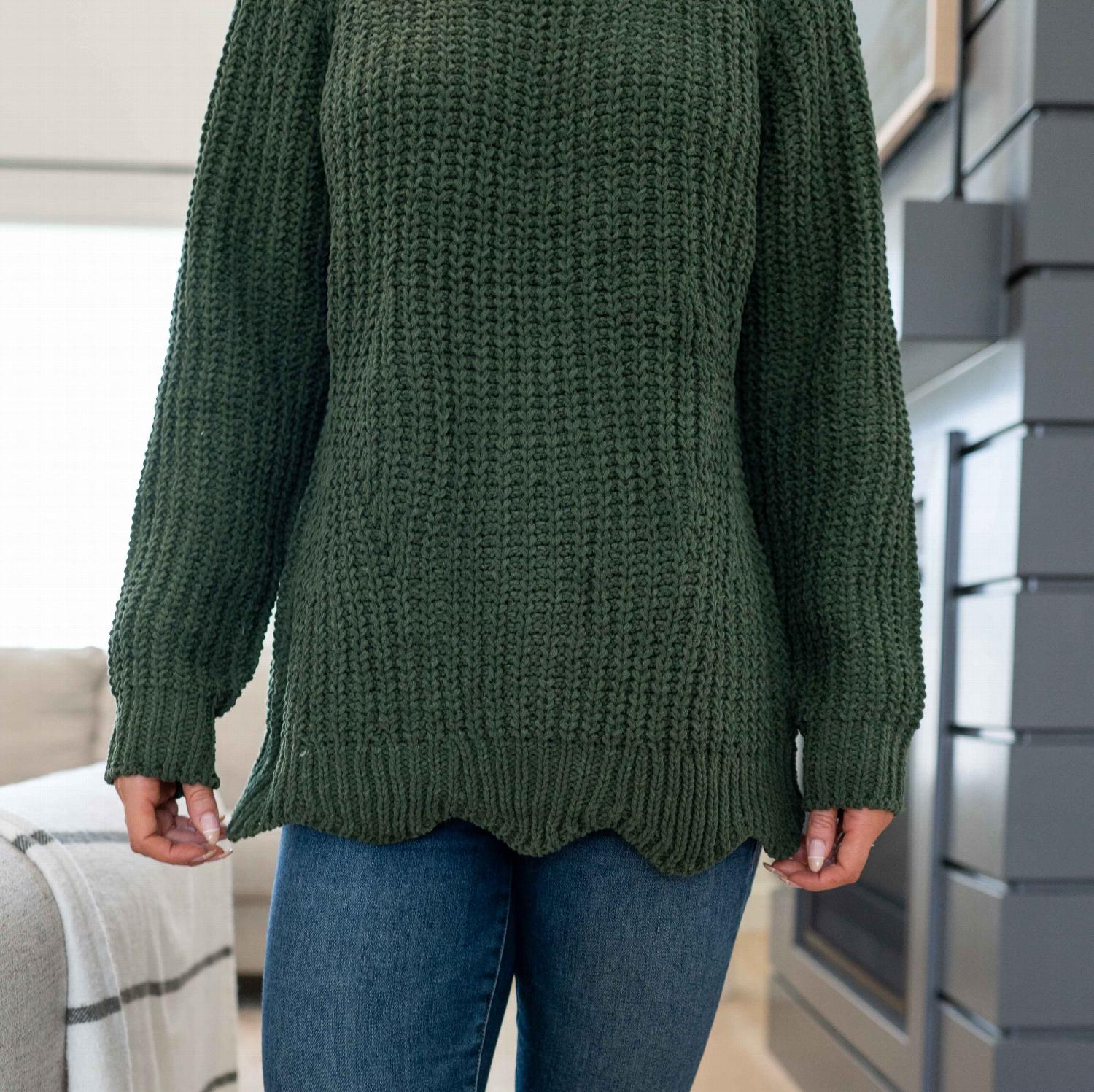 A stylish Scallop Hem Sweater featuring a jagged hemline and ribbed texture, perfect for fall and winter wear.