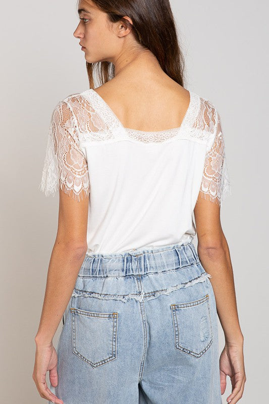 A stylish Scallop Trim Lace Short Sleeve Top featuring lace scallop sleeves and a low V neckline, perfect for casual and formal occasions.