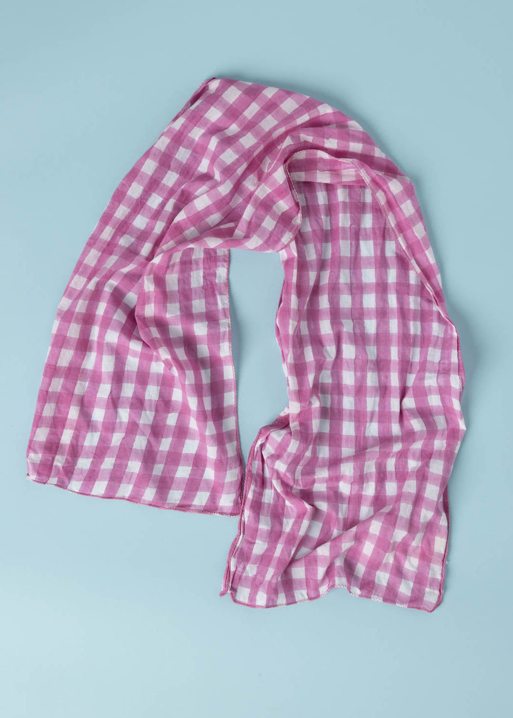 Gingham Picnic Skinny Dahlia scarf made from organic cotton, featuring a unique block print design, perfect for versatile styling.