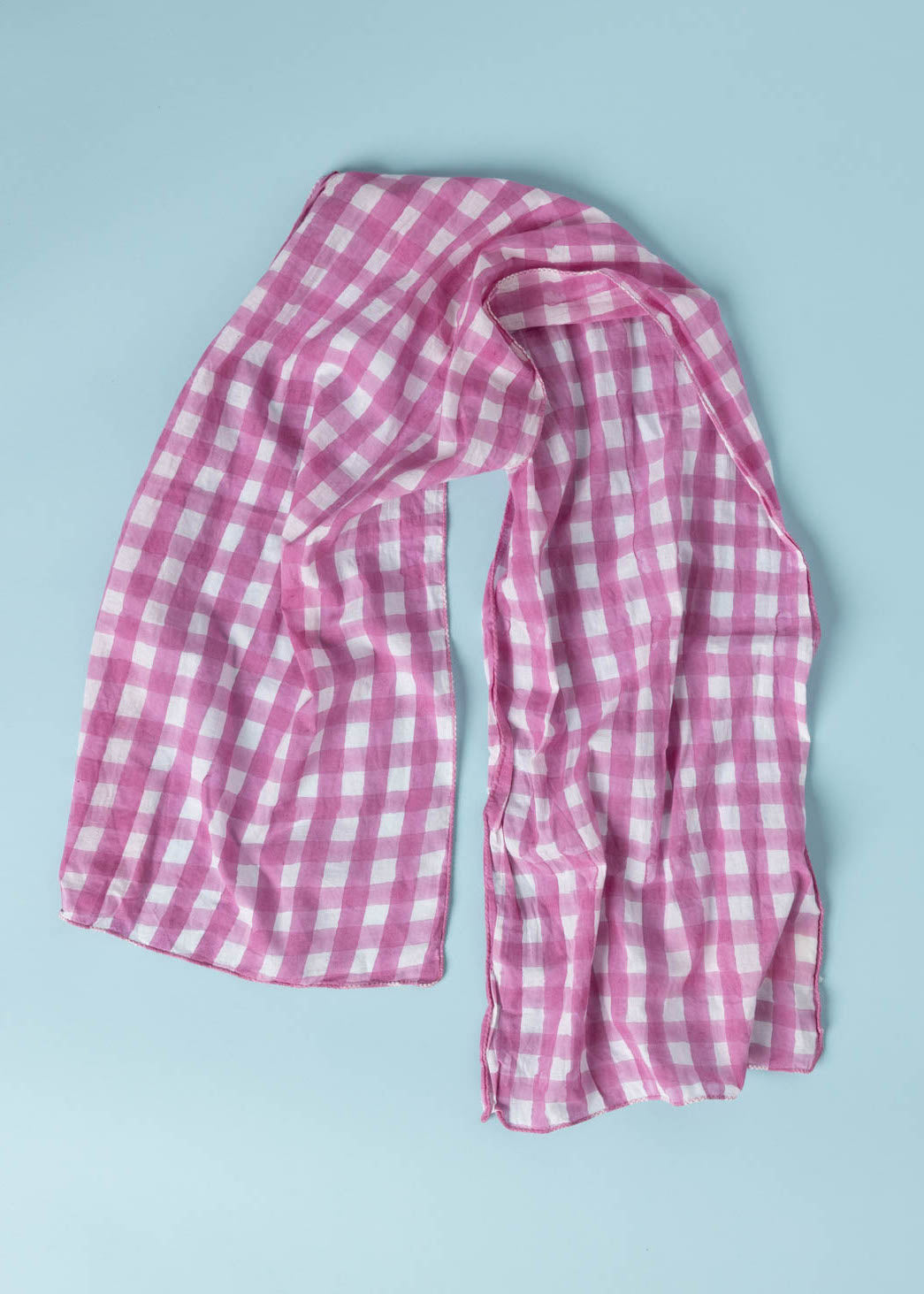 Gingham Picnic Skinny Dahlia scarf made from organic cotton, featuring a unique block print design, perfect for versatile styling.