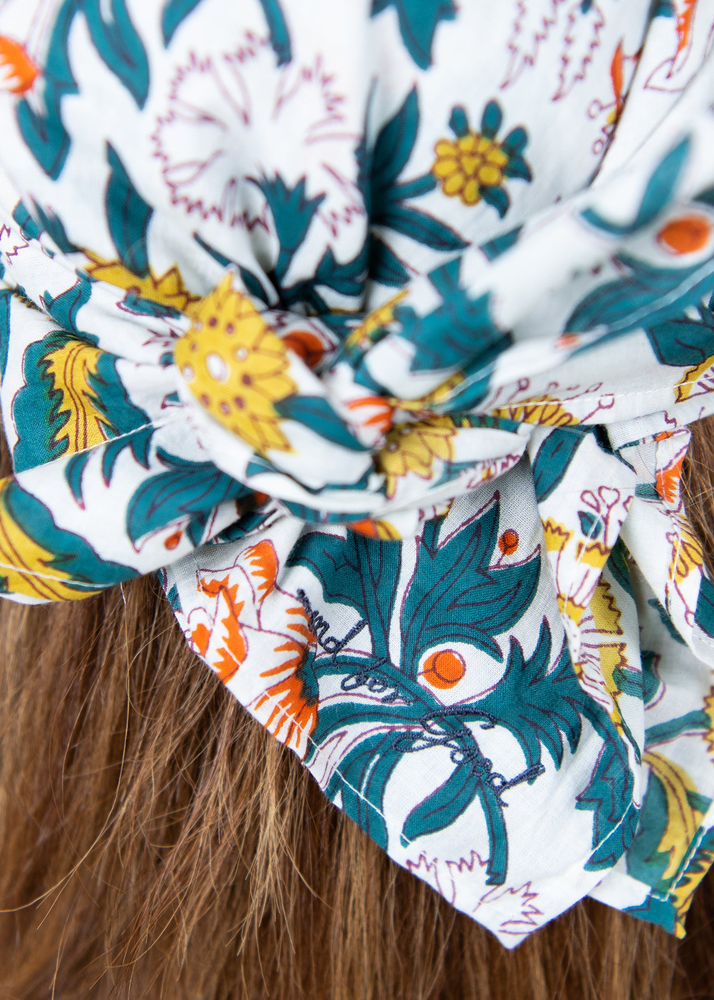 A beautifully crafted Sketch Floral Square Scarf featuring vibrant floral patterns, made from organic cotton, showcasing traditional Indian craftsmanship.