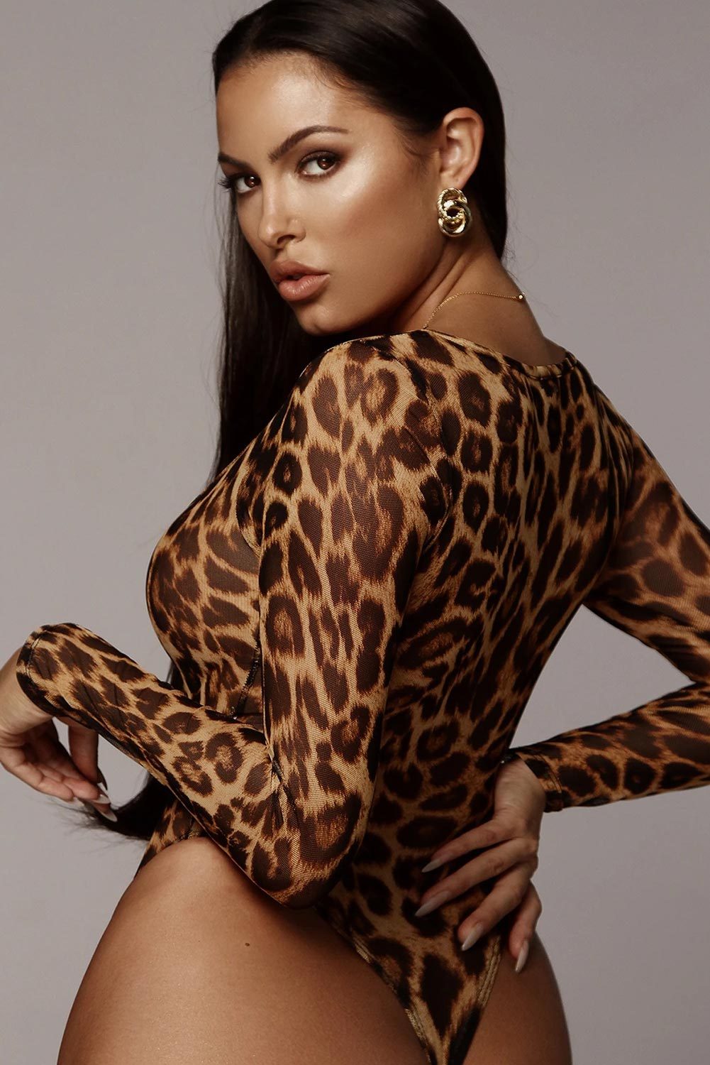 Scoop Neck Cheetah Mesh Bodysuit featuring a sexy leopard print design, long sleeves, and a flattering scoop neck.