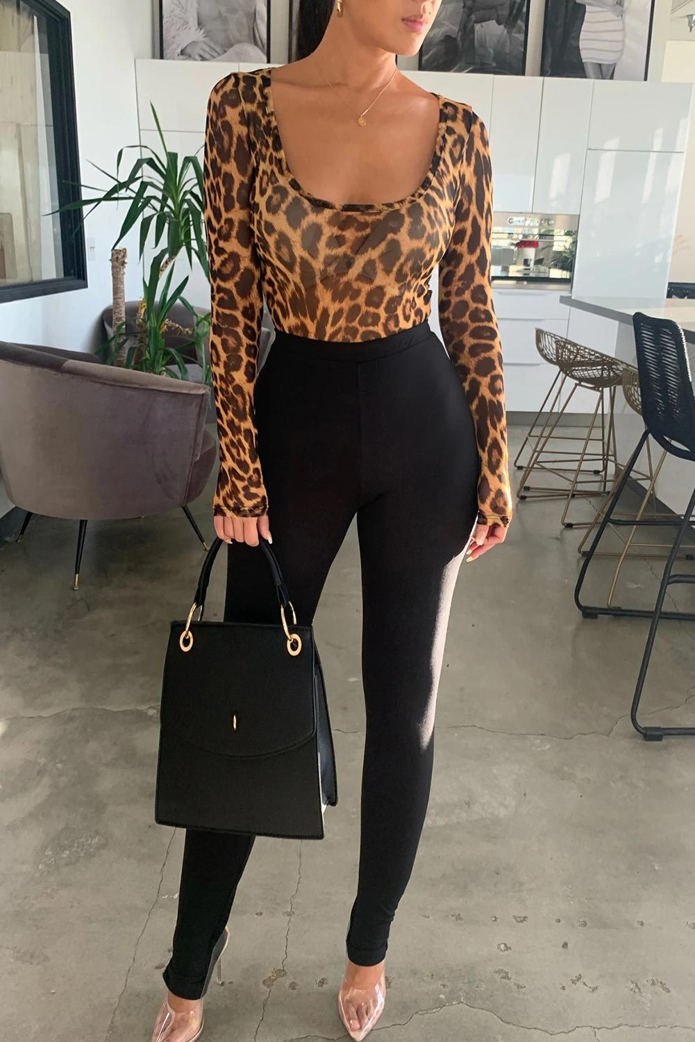 Scoop Neck Cheetah Mesh Bodysuit featuring a sexy leopard print design, long sleeves, and a flattering scoop neck.