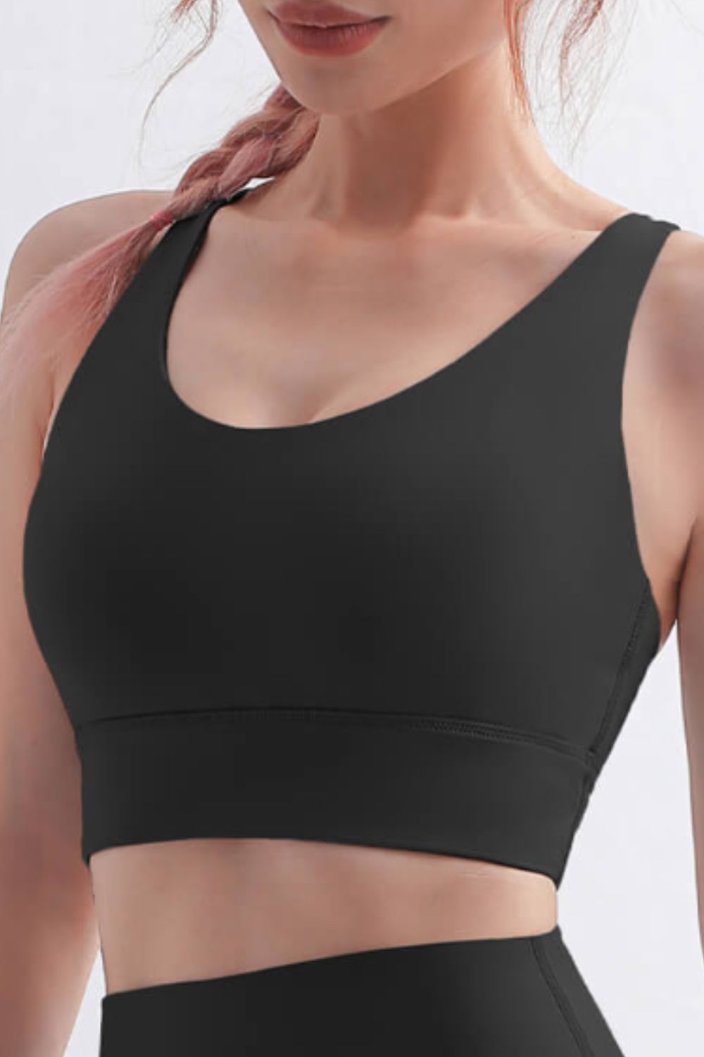 Scoop Neck Crisscross Back Sports Bra in solid color, showcasing its stylish design and comfortable fit, perfect for yoga and workouts.