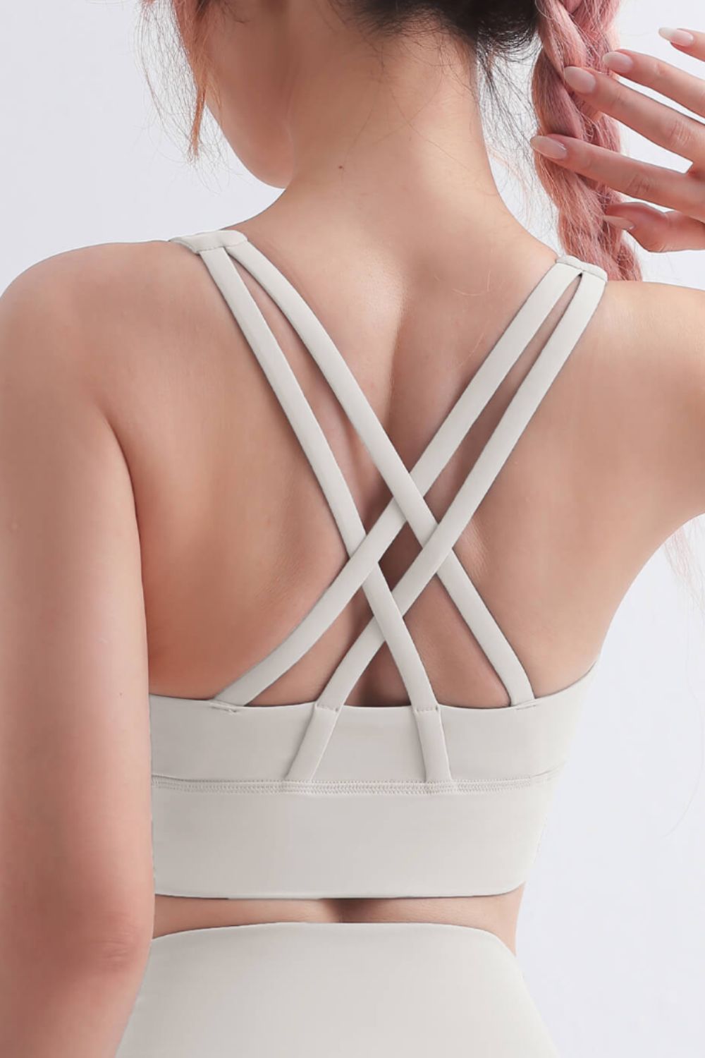 Scoop Neck Crisscross Back Sports Bra in solid color, showcasing its stylish design and comfortable fit, perfect for yoga and workouts.