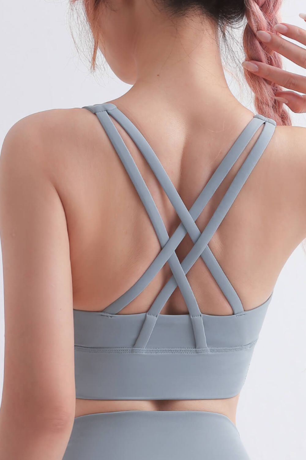 Scoop Neck Crisscross Back Sports Bra in solid color, showcasing its stylish design and comfortable fit, perfect for yoga and workouts.