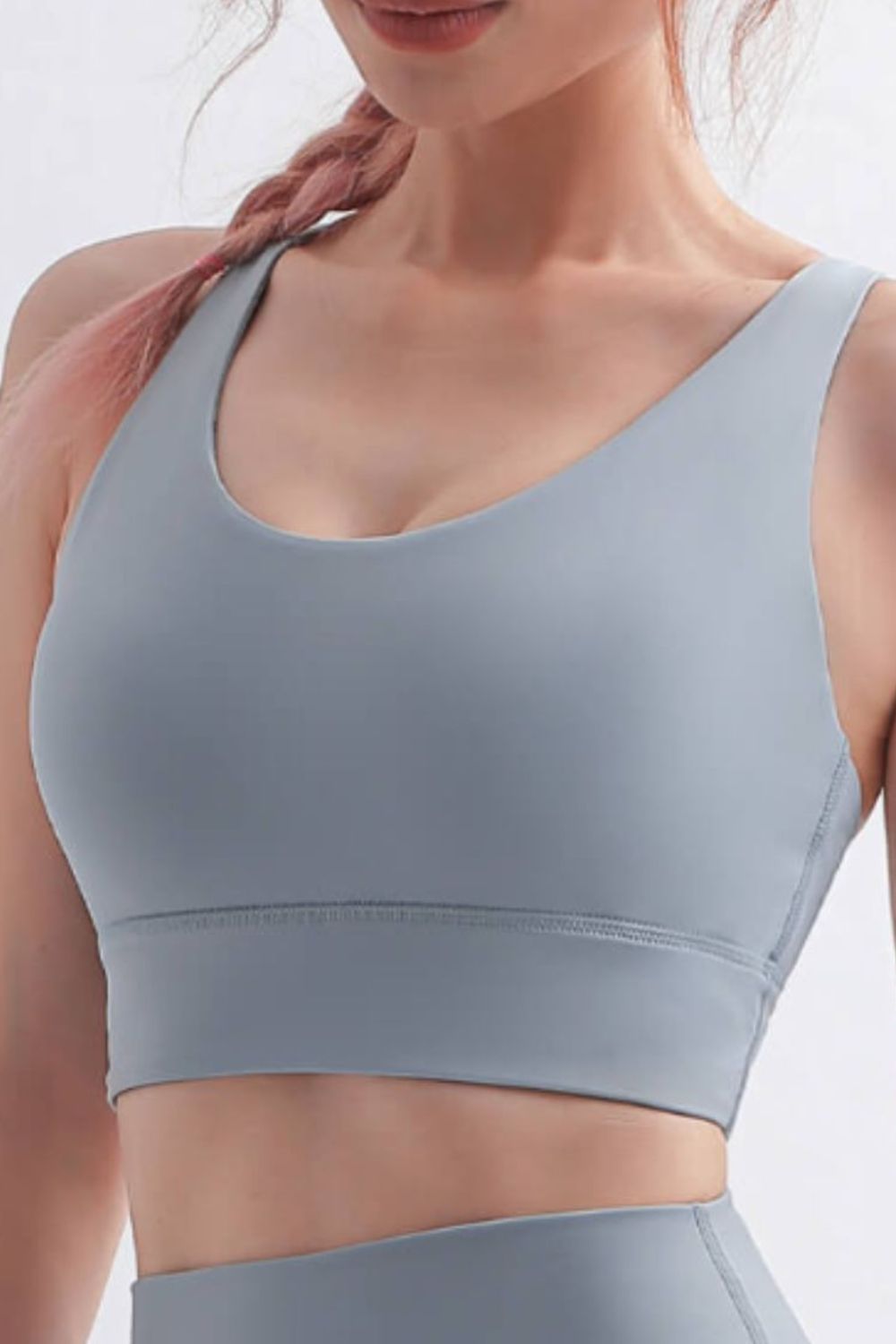 Scoop Neck Crisscross Back Sports Bra in solid color, showcasing its stylish design and comfortable fit, perfect for yoga and workouts.