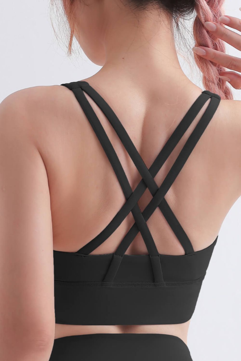 Scoop Neck Crisscross Back Sports Bra in solid color, showcasing its stylish design and comfortable fit, perfect for yoga and workouts.