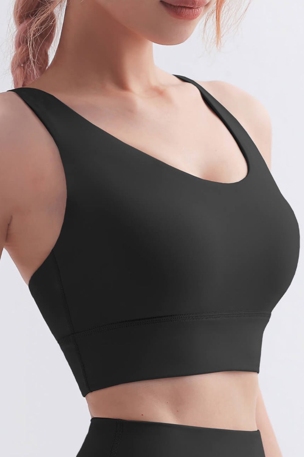 Scoop Neck Crisscross Back Sports Bra in solid color, showcasing its stylish design and comfortable fit, perfect for yoga and workouts.