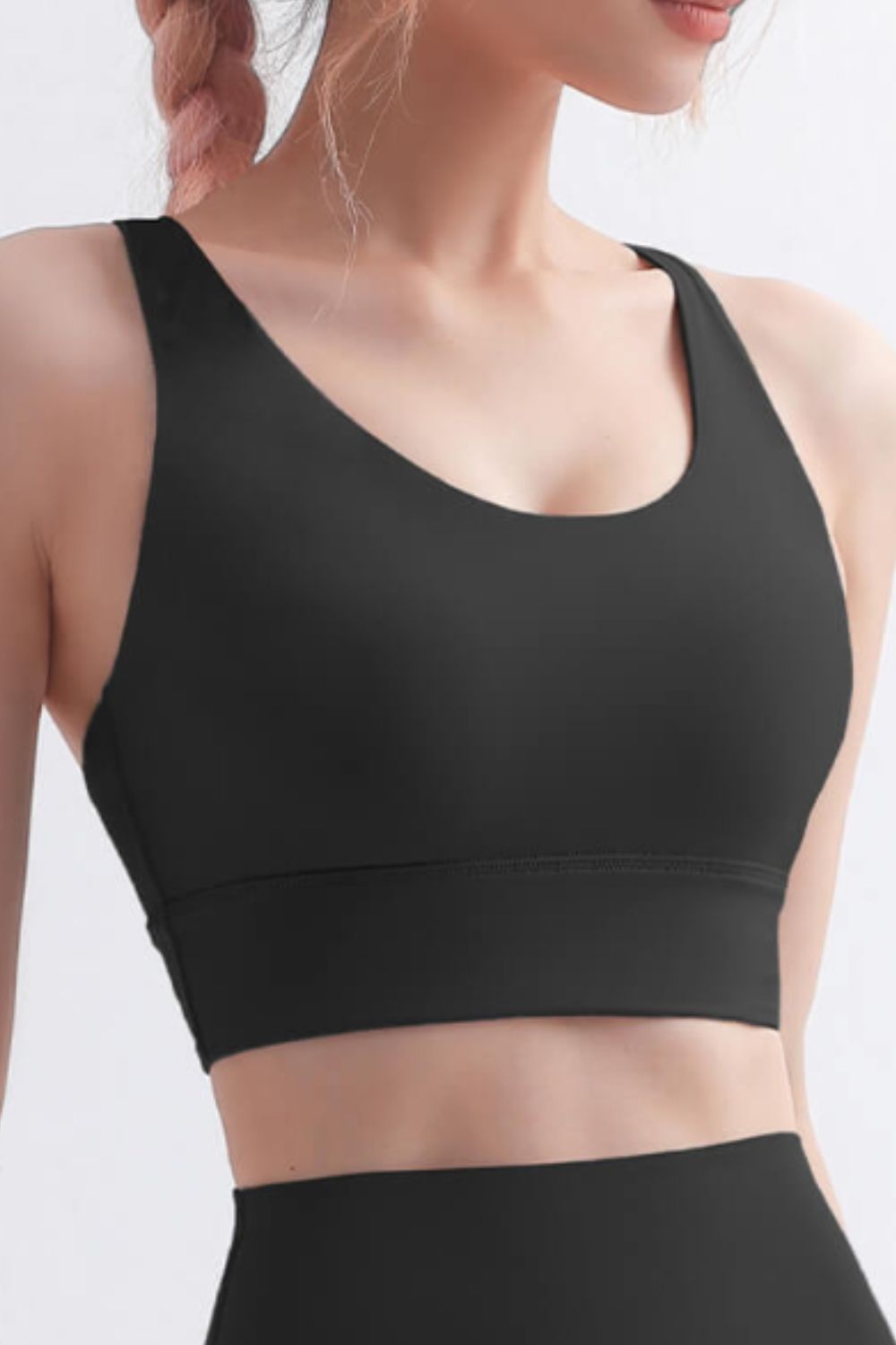 Scoop Neck Crisscross Back Sports Bra in solid color, showcasing its stylish design and comfortable fit, perfect for yoga and workouts.