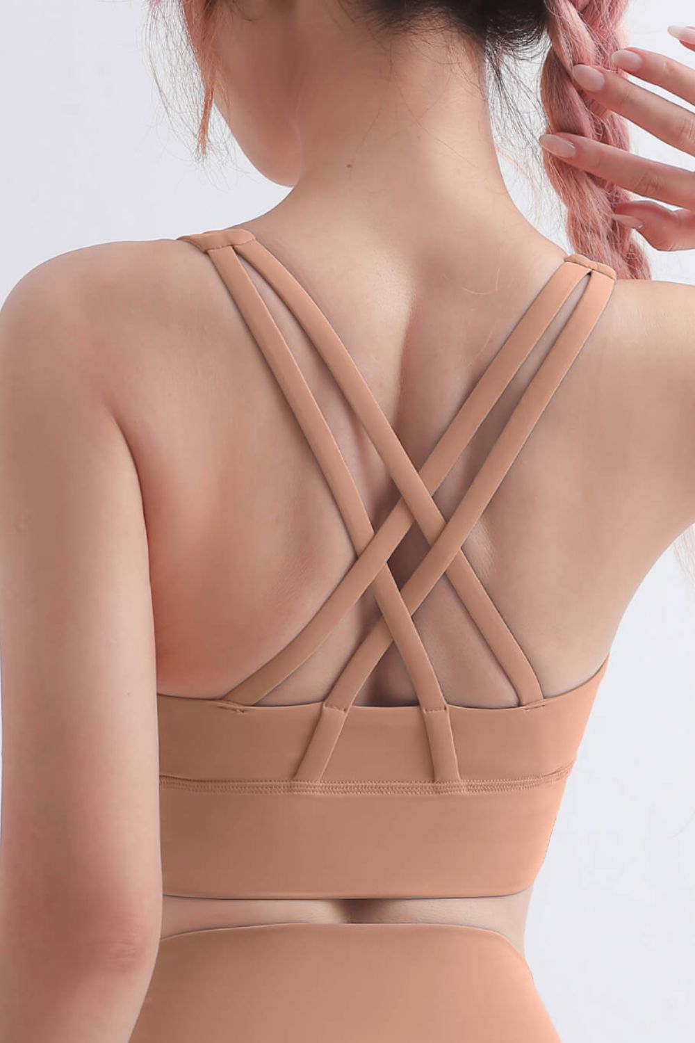 Scoop Neck Crisscross Back Sports Bra in solid color, showcasing its stylish design and comfortable fit, perfect for yoga and workouts.