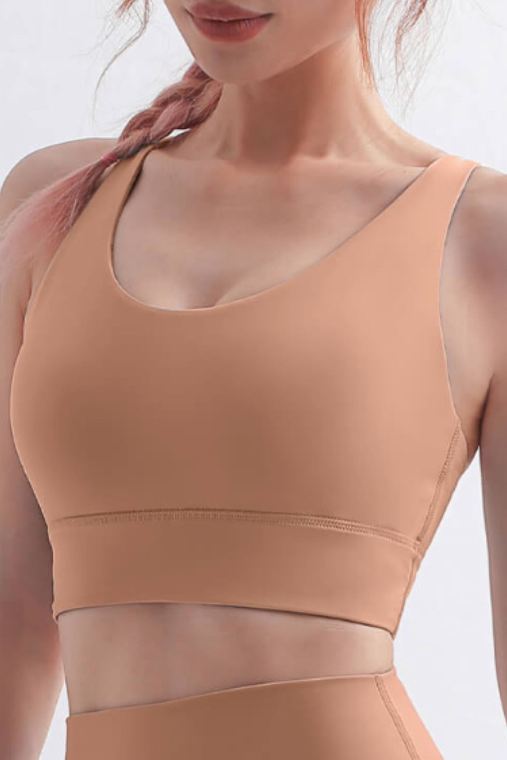 Scoop Neck Crisscross Back Sports Bra in solid color, showcasing its stylish design and comfortable fit, perfect for yoga and workouts.