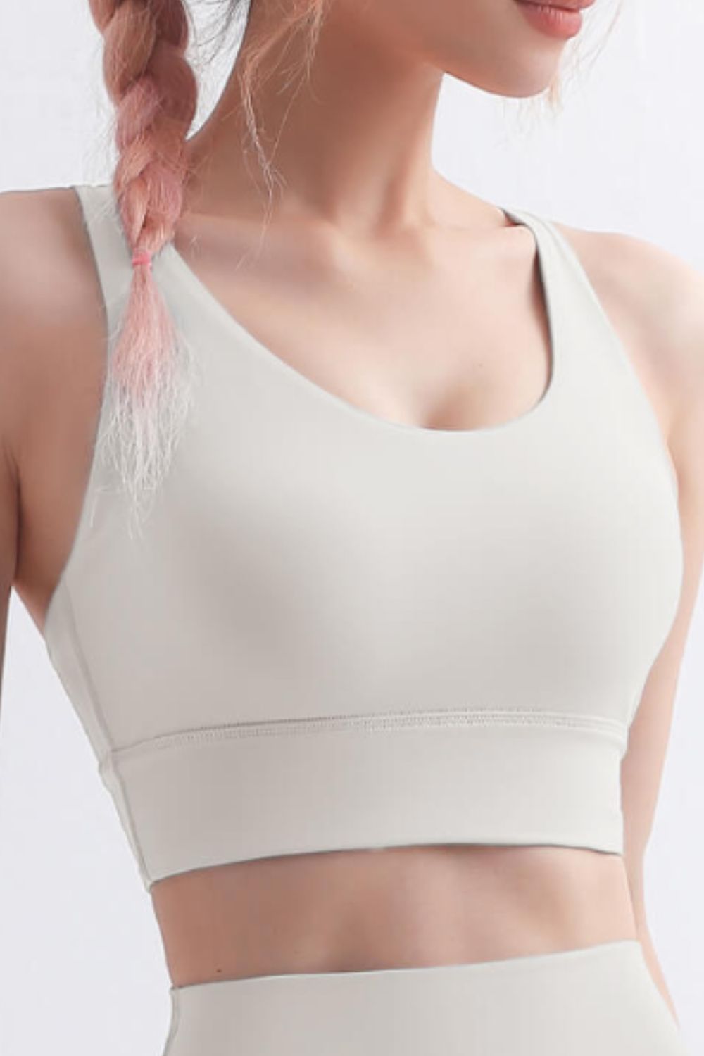 Scoop Neck Crisscross Back Sports Bra in solid color, showcasing its stylish design and comfortable fit, perfect for yoga and workouts.