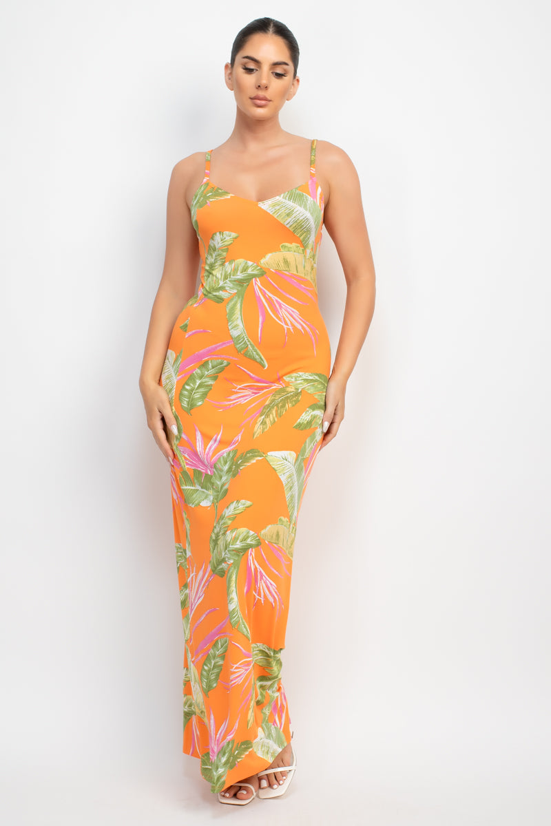 A vibrant orange maxi dress with a tropical print, featuring a scoop neckline and adjustable cami straps, perfect for summer outings.