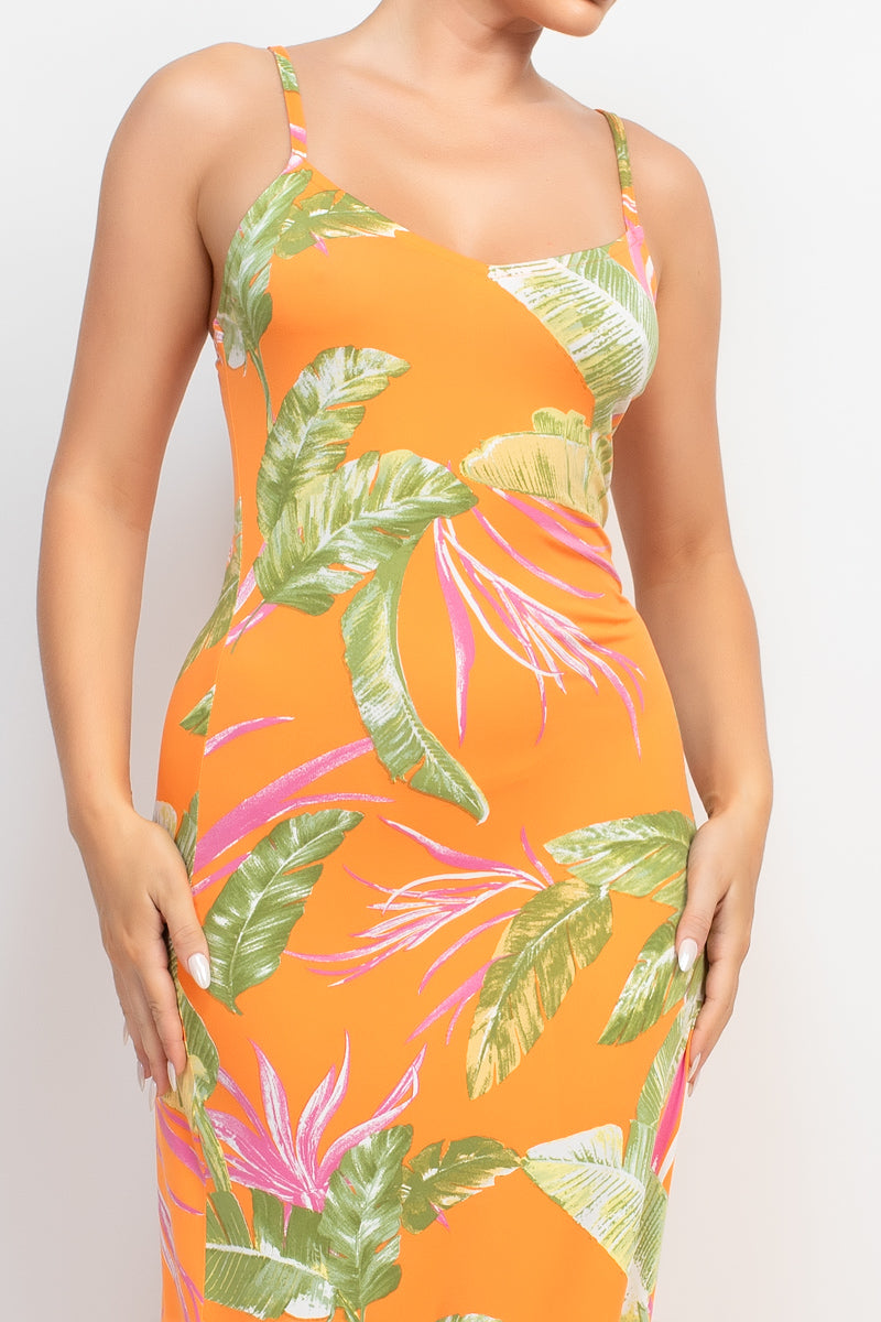 A vibrant orange maxi dress with a tropical print, featuring a scoop neckline and adjustable cami straps, perfect for summer outings.