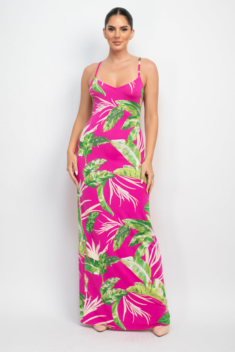 A vibrant Scoop Tropical Print Maxi Dress featuring a bold tropical design, scoop neckline, and adjustable cami straps, perfect for summer outings.