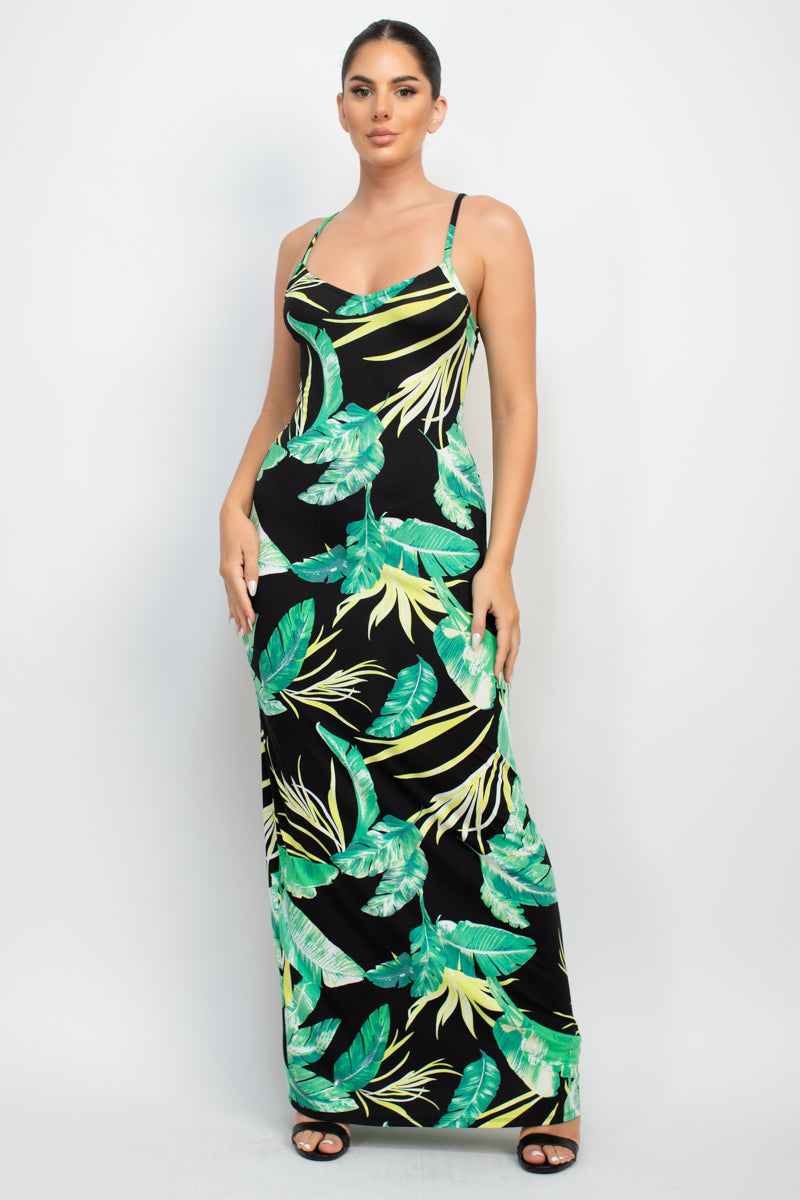 A stylish Scoop Tropical Print Maxi Dress featuring a vibrant tropical print, scoop neckline, and adjustable cami straps, perfect for summer outings.