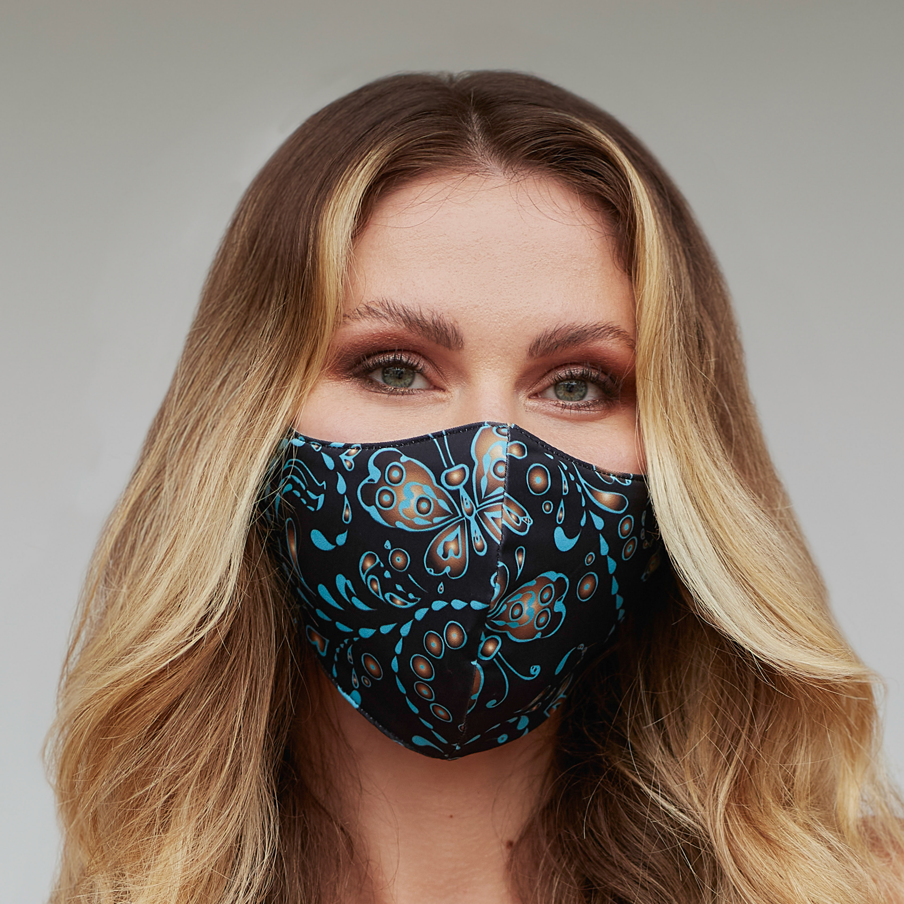 Seamless Butterfly Face Mask featuring a vibrant butterfly design, perfect for style and protection.