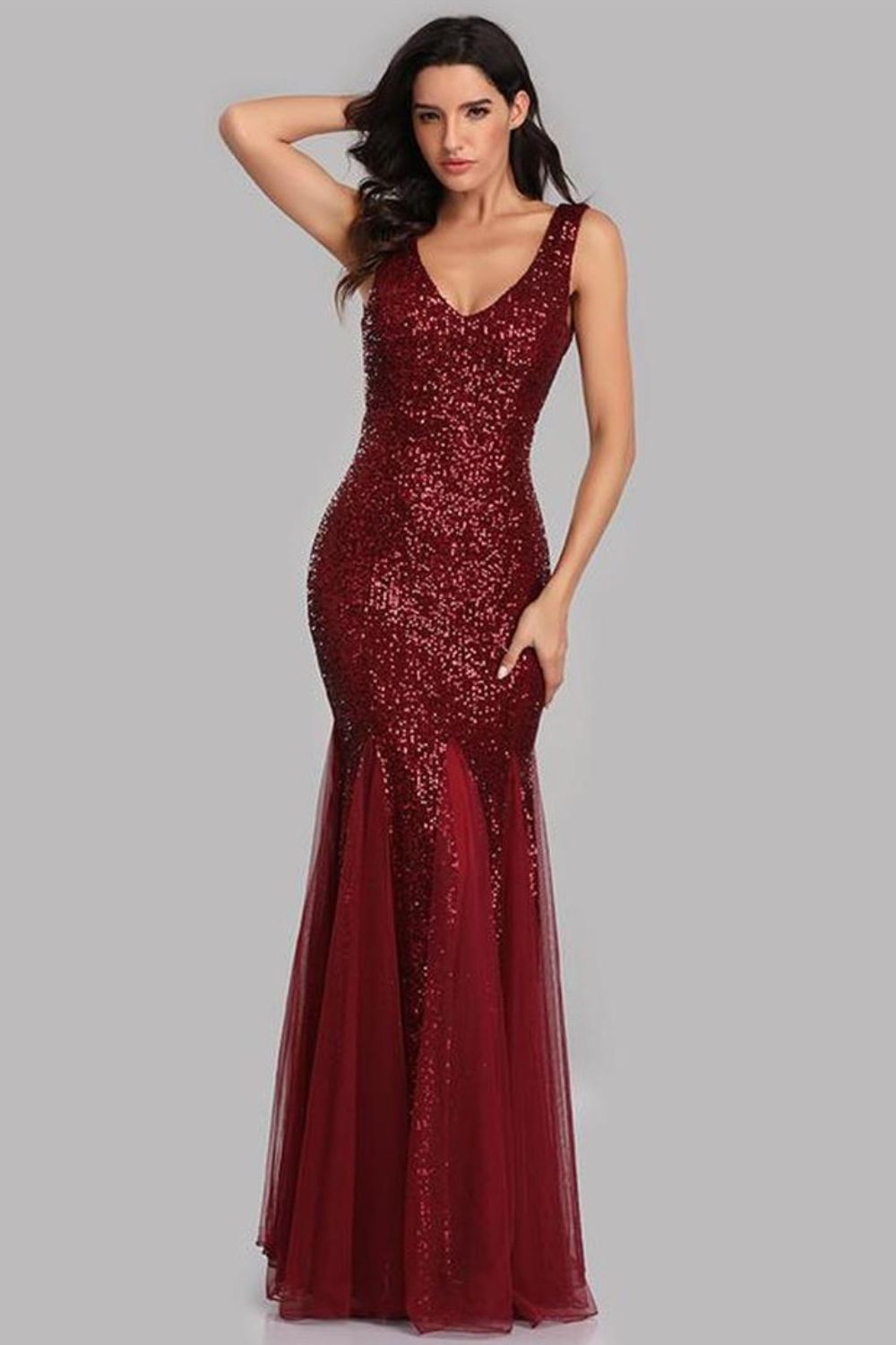 A glamorous Sequin Sleeveless Plunge Spliced Mesh Fishtail Dress featuring a V-neckline and a dramatic fishtail hem, perfect for evening events.