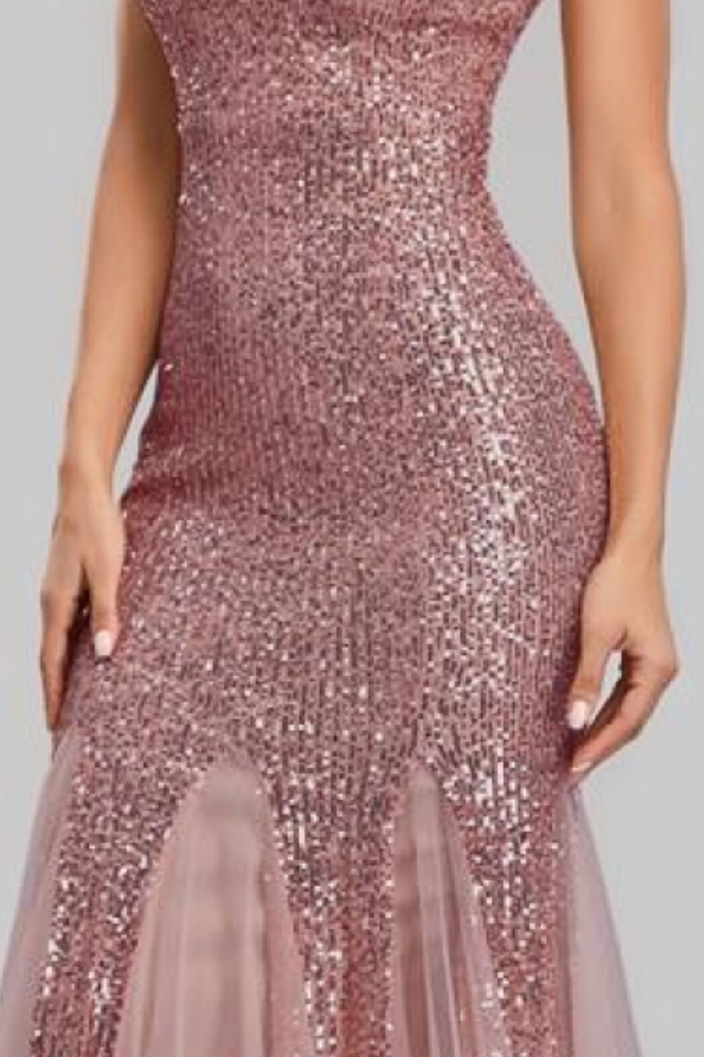 A glamorous Sequin Sleeveless Plunge Spliced Mesh Fishtail Dress featuring a V-neckline and a dramatic fishtail hem, perfect for evening events.