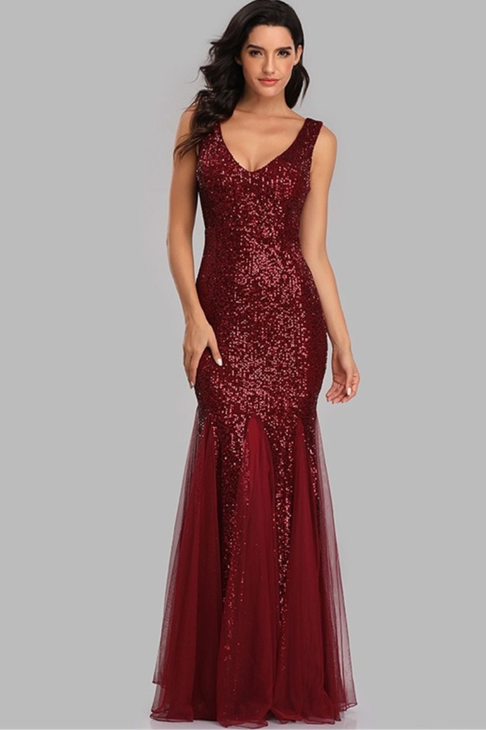 A glamorous Sequin Sleeveless Plunge Spliced Mesh Fishtail Dress featuring a V-neckline and a dramatic fishtail hem, perfect for evening events.